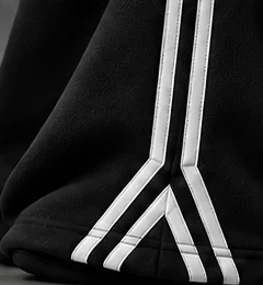 Black: A split stripe detail at the hem.